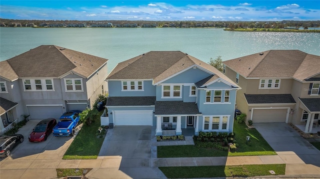 aerial view featuring a residential view and a water view