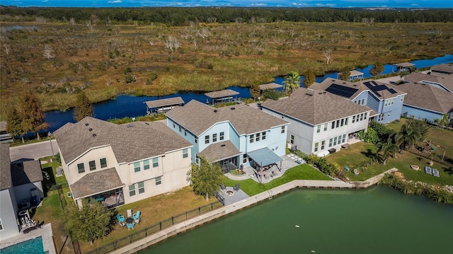 aerial view with a residential view and a water view