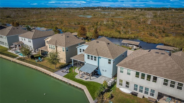 aerial view featuring a residential view and a water view