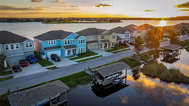 bird's eye view with a residential view and a water view