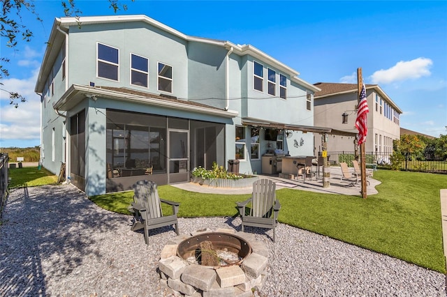 back of property featuring a patio, fence, a sunroom, and an outdoor fire pit