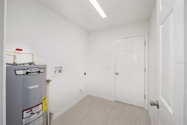 laundry area with electric dryer hookup, light wood-type flooring, hookup for a washing machine, and water heater