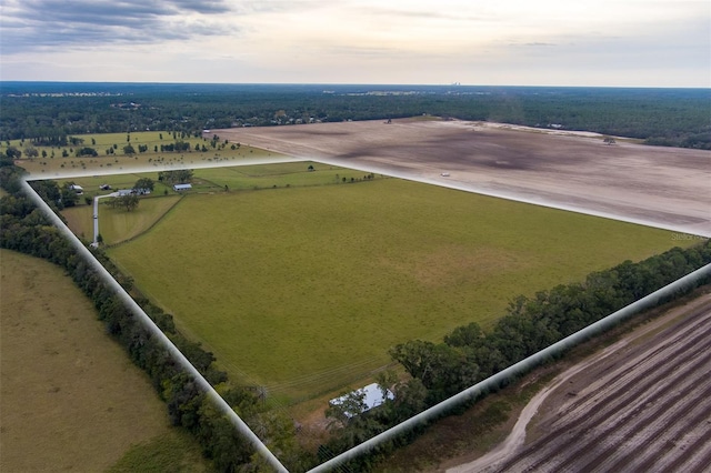 birds eye view of property featuring a rural view