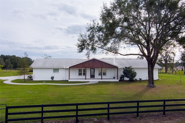 ranch-style home with a front lawn