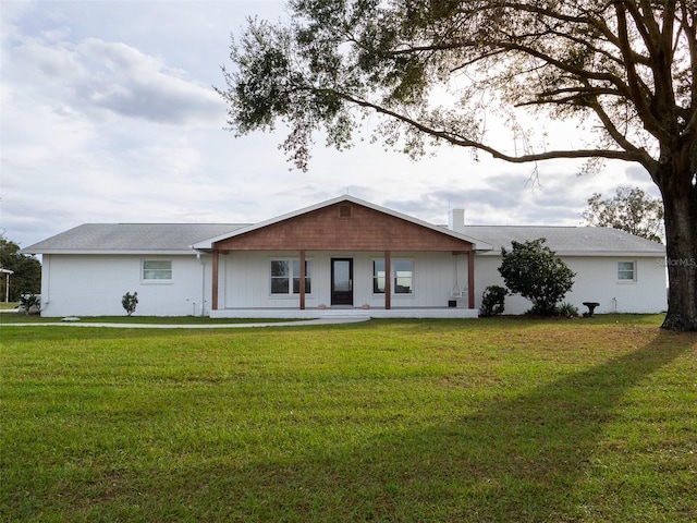 ranch-style home featuring a front yard