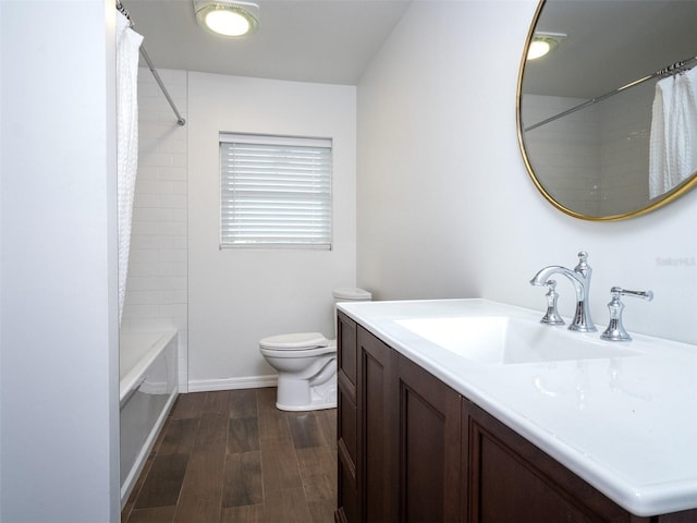 full bathroom featuring hardwood / wood-style flooring, vanity, toilet, and shower / tub combo