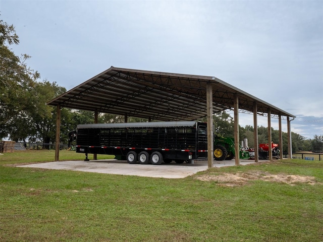 view of parking / parking lot with a carport and a lawn