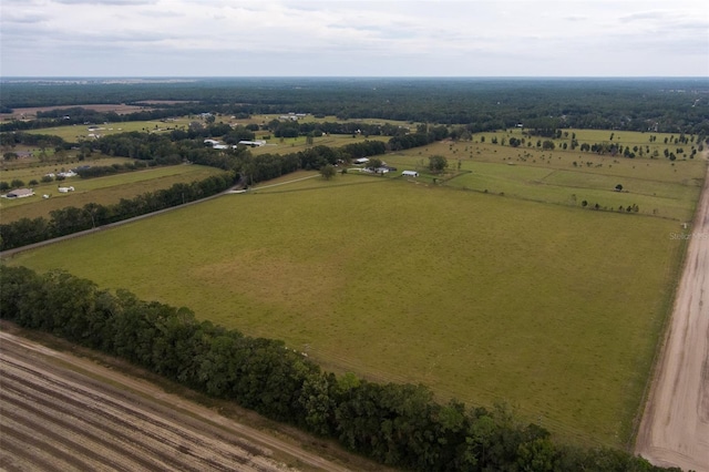 birds eye view of property with a rural view