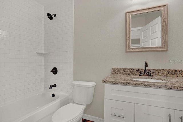 full bathroom featuring vanity, toilet, and tiled shower / bath