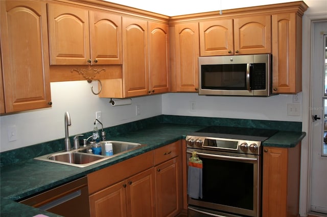 kitchen with sink and appliances with stainless steel finishes