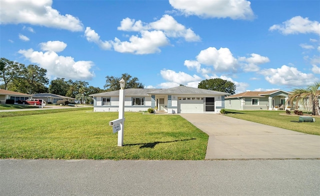 ranch-style home with a garage and a front lawn