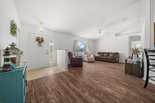 interior space featuring ceiling fan, hardwood / wood-style floors, and vaulted ceiling