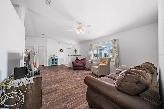 living room featuring hardwood / wood-style flooring, ceiling fan, and vaulted ceiling