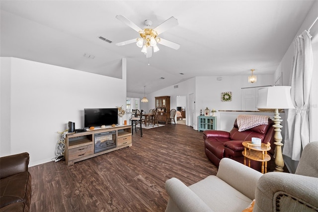 living room with ceiling fan, dark wood-type flooring, and lofted ceiling