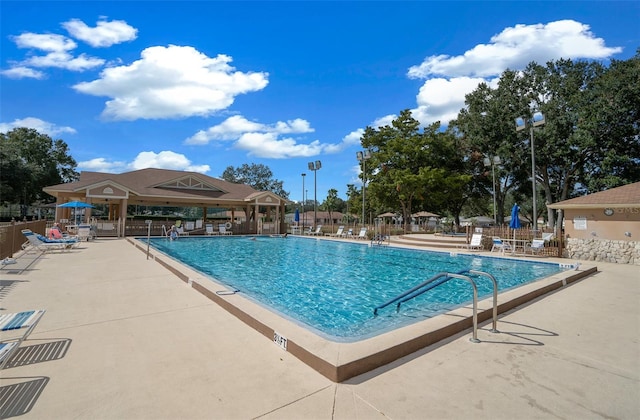 view of swimming pool with a patio