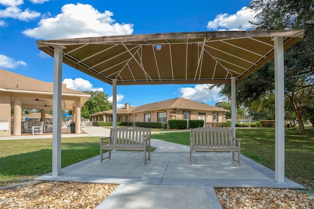 view of home's community featuring a gazebo, a lawn, and a patio