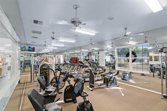 workout area featuring a textured ceiling