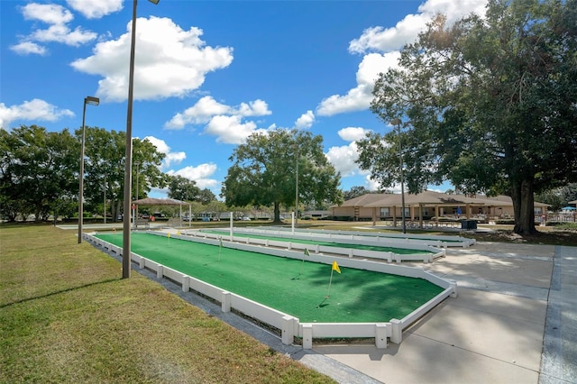 view of home's community with a yard