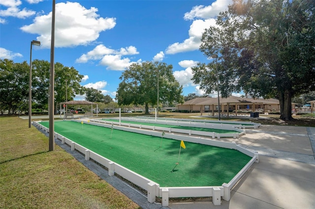 view of property's community featuring a yard