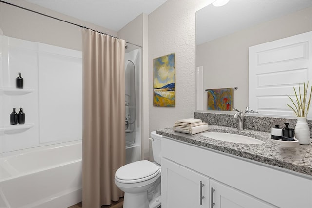 full bathroom featuring shower / tub combo, vanity, and toilet