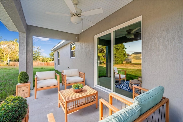 view of patio with ceiling fan and an outdoor living space