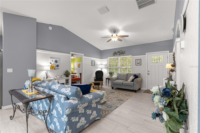 living room with ceiling fan and lofted ceiling