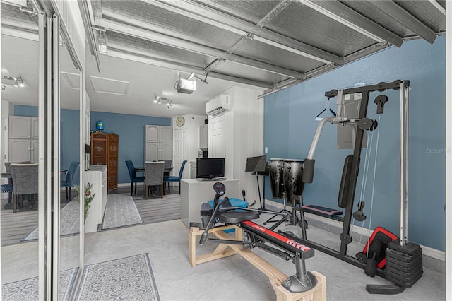 workout area featuring an AC wall unit