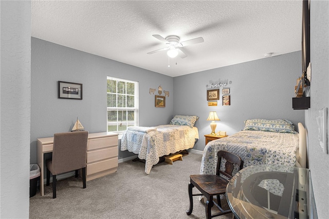 bedroom featuring carpet, a textured ceiling, and ceiling fan