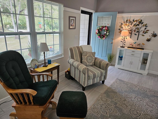 sitting room with wood tiled floor and baseboards