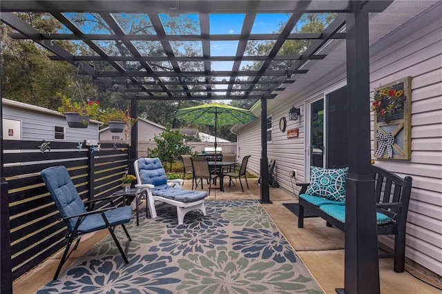 view of patio with outdoor dining area and a pergola