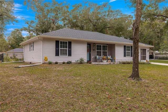 ranch-style house with a porch and a front lawn