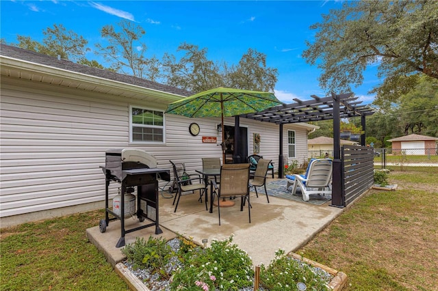 view of patio featuring outdoor dining area, fence, and a pergola