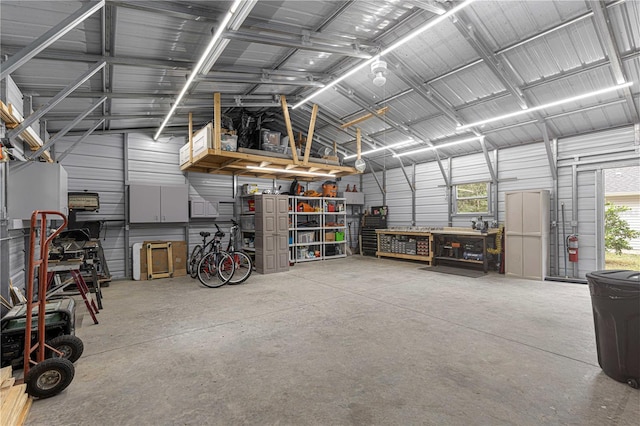 garage featuring metal wall and a workshop area