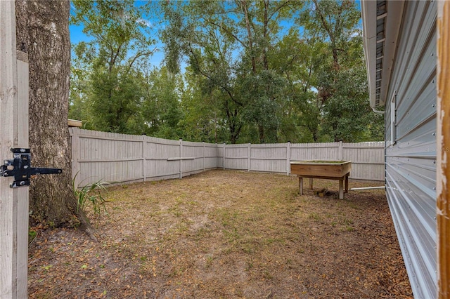 view of yard with a fenced backyard