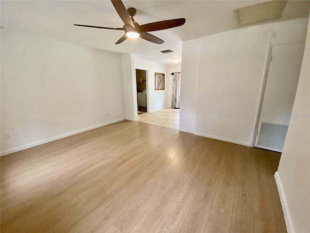 spare room featuring ceiling fan and light hardwood / wood-style flooring