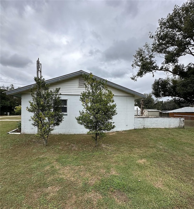 view of home's exterior featuring a lawn