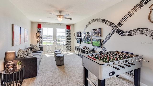 recreation room featuring carpet and ceiling fan