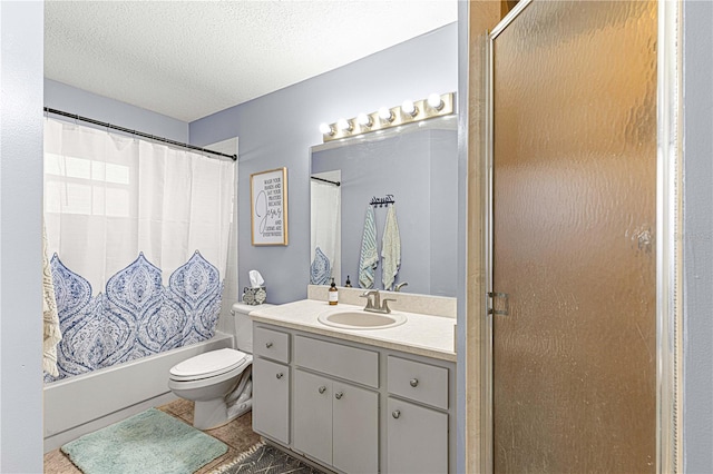 full bathroom featuring shower / bath combo with shower curtain, vanity, a textured ceiling, and toilet