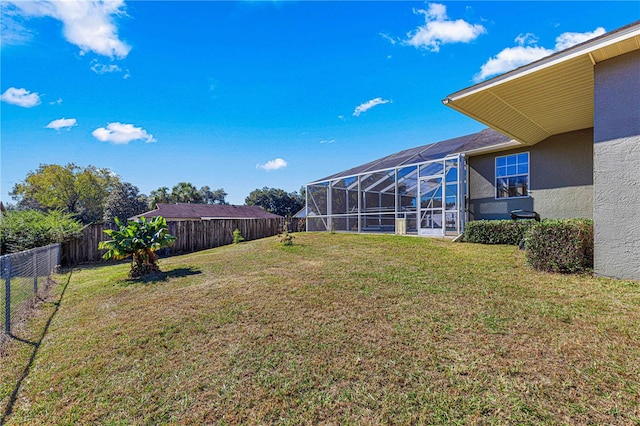 view of yard featuring a lanai