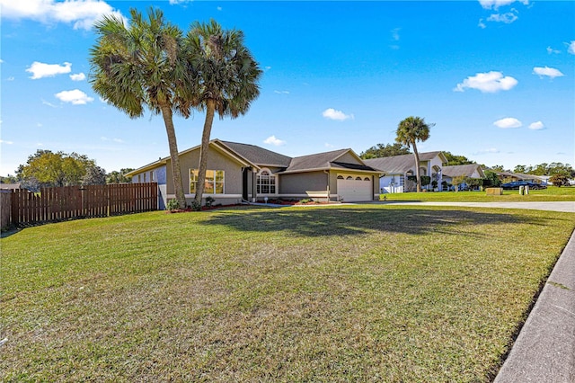 ranch-style home with a front yard and a garage