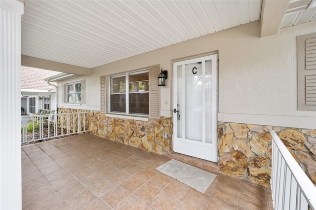 property entrance with a porch