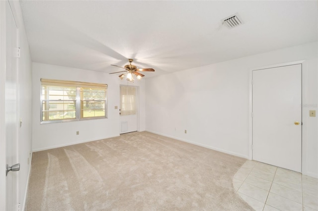 empty room with light carpet and ceiling fan