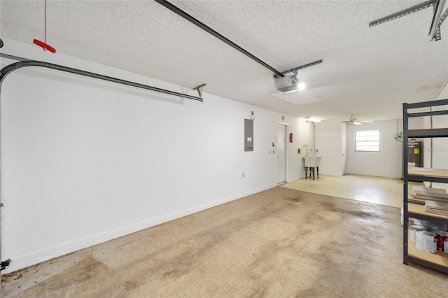 garage featuring ceiling fan, electric panel, sink, and a garage door opener