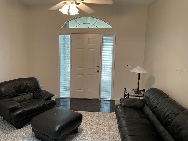 tiled entryway with ceiling fan