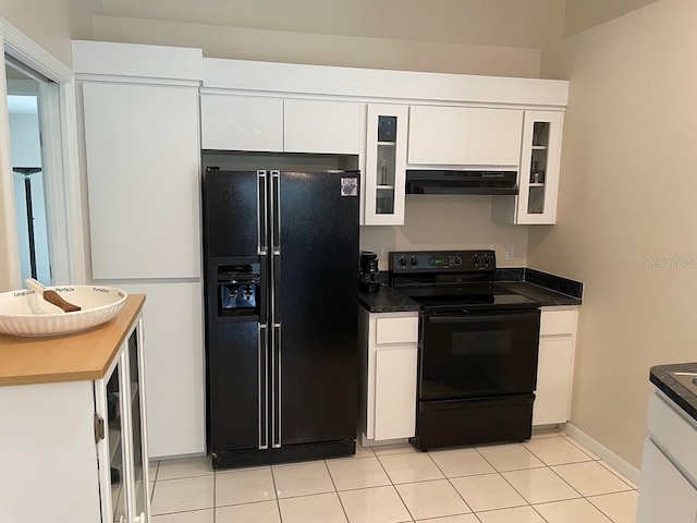 kitchen featuring exhaust hood, black appliances, white cabinets, light tile patterned floors, and beverage cooler