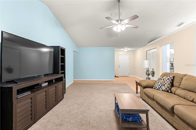 carpeted living room with ceiling fan and lofted ceiling