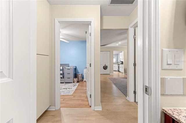 hallway featuring light wood-type flooring