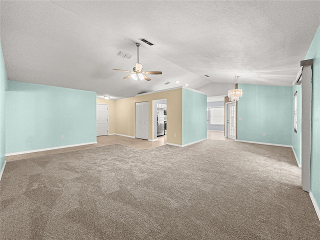 unfurnished living room featuring baseboards, visible vents, and lofted ceiling
