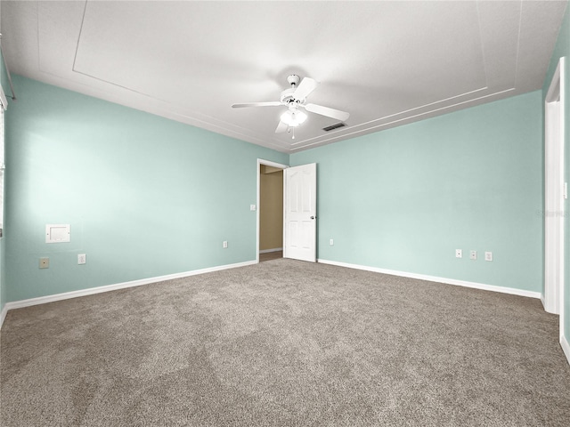 unfurnished bedroom with baseboards, a ceiling fan, carpet flooring, and visible vents