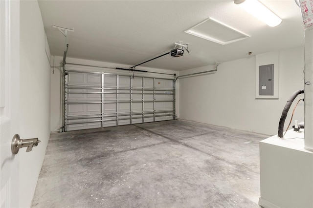 garage with a garage door opener and electric panel